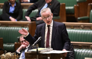 Michael Gove in houses of parliaments